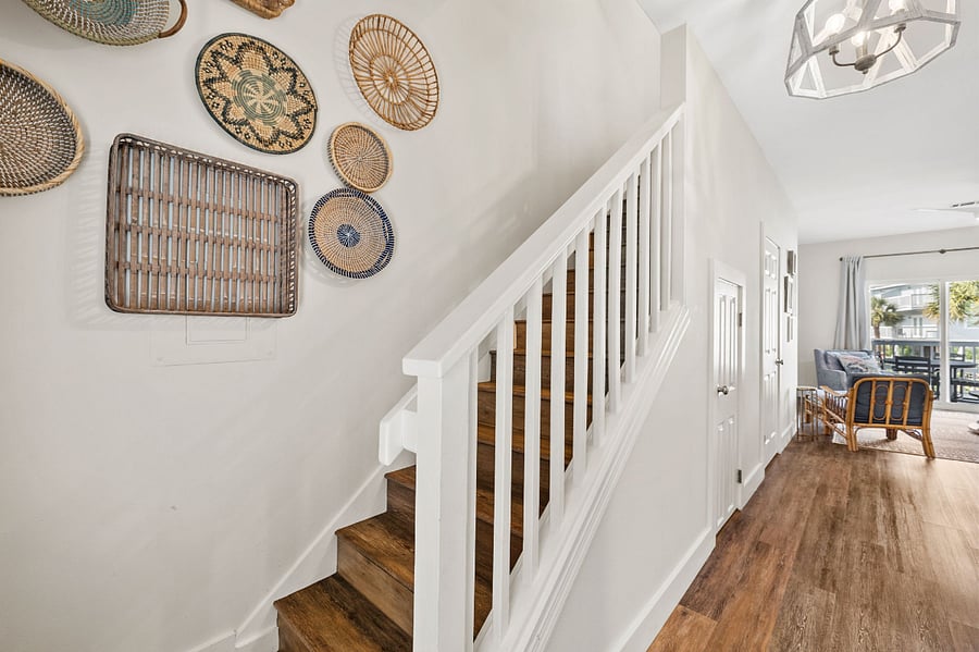 Stairs leading up to two bedrooms and one full bathroom