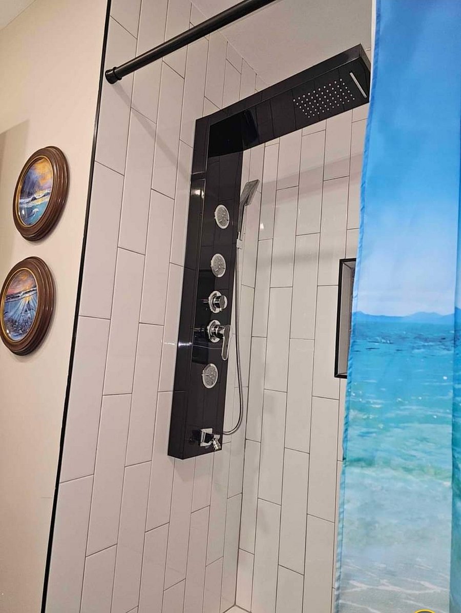 Shared bathroom with waterfall/rain forest body jets