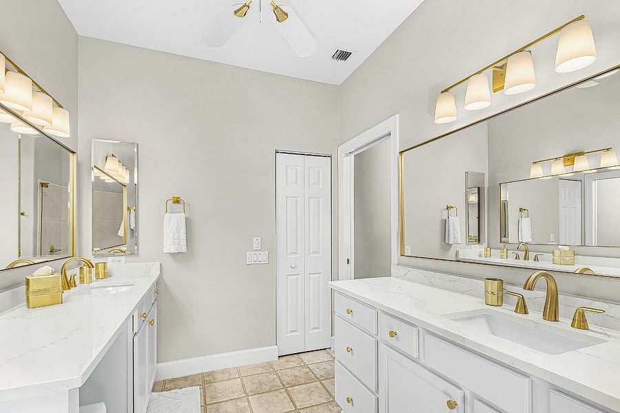 Primary bathroom with double sinks and walk in shower
