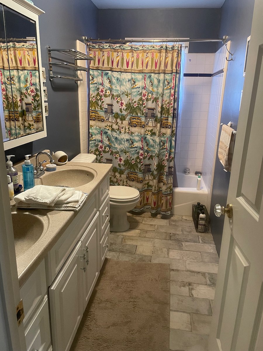 Bathroom with two sinks, vanity drawers and mirror storage cabinet