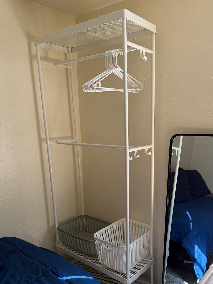 Freestanding closet customizable clothes rack for full height clothing or double up for shirts and slacks. Shoes can neatly tuck into the shelves at the bottom.