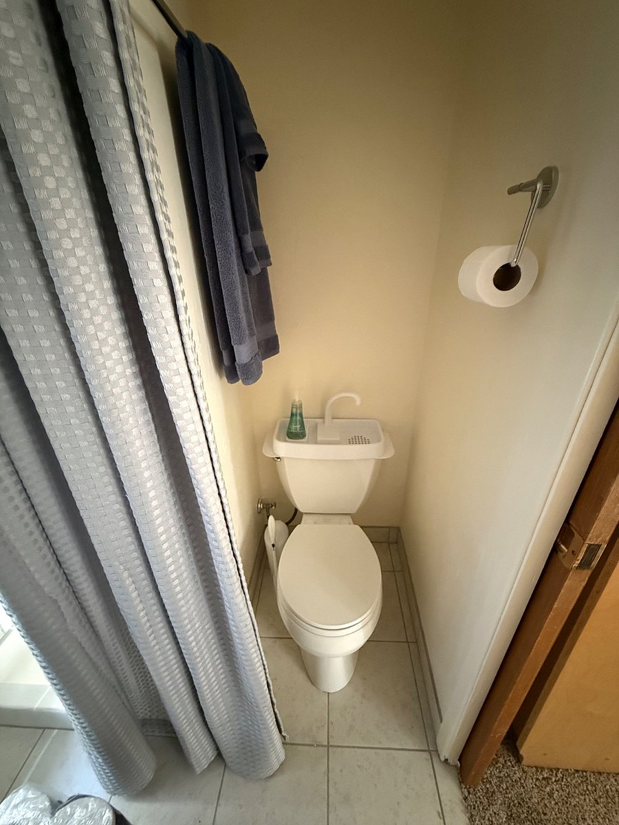 Toilet area in the Refresh Alcove with hygienic fresh water sink. Can be discreetly closed off by a curtainor when not in use..