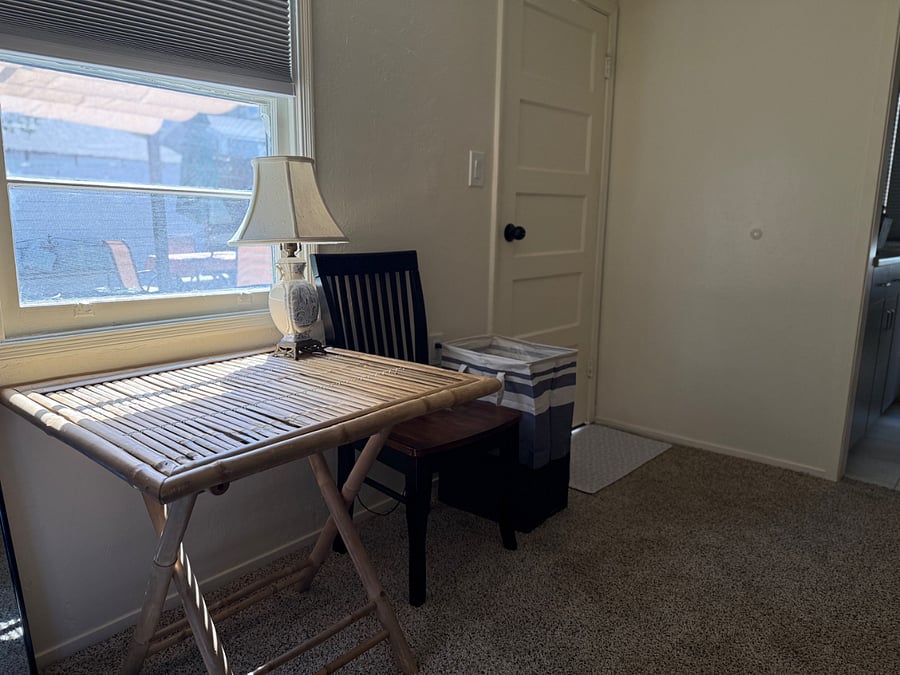 For laptop or eating, this bamboo table can be collapsed and tucked against wall when not needed, maximizing space in this compact space.
