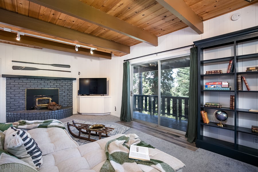 Room includes two sleeper sized sofa's, smart TV, Nintendo gaming console, and fireplace
