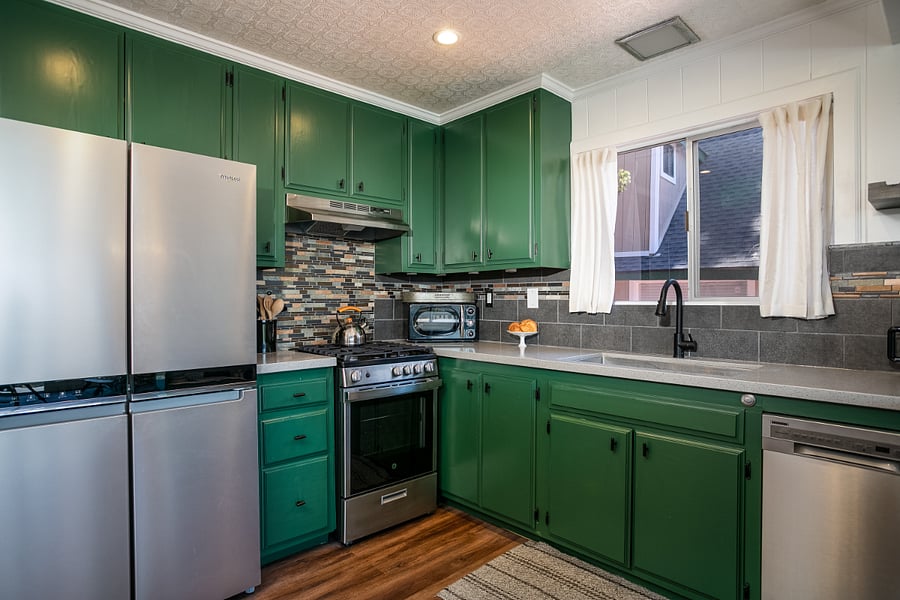 Stainless steal, 4-Door refrigerator, gas range oven, garbage disposal, microwave and toaster