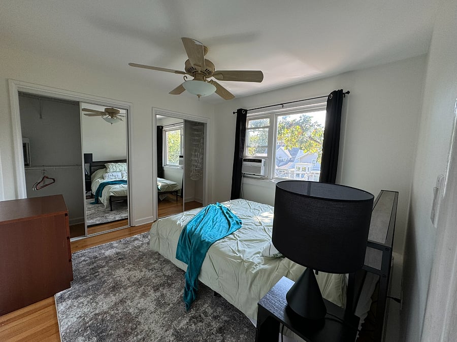 Queen bed with built-in LED lights in the headboard and USB outlets for extra convenience.  South-facing window brings in GREAT light. Yes, those are black-out curtains!