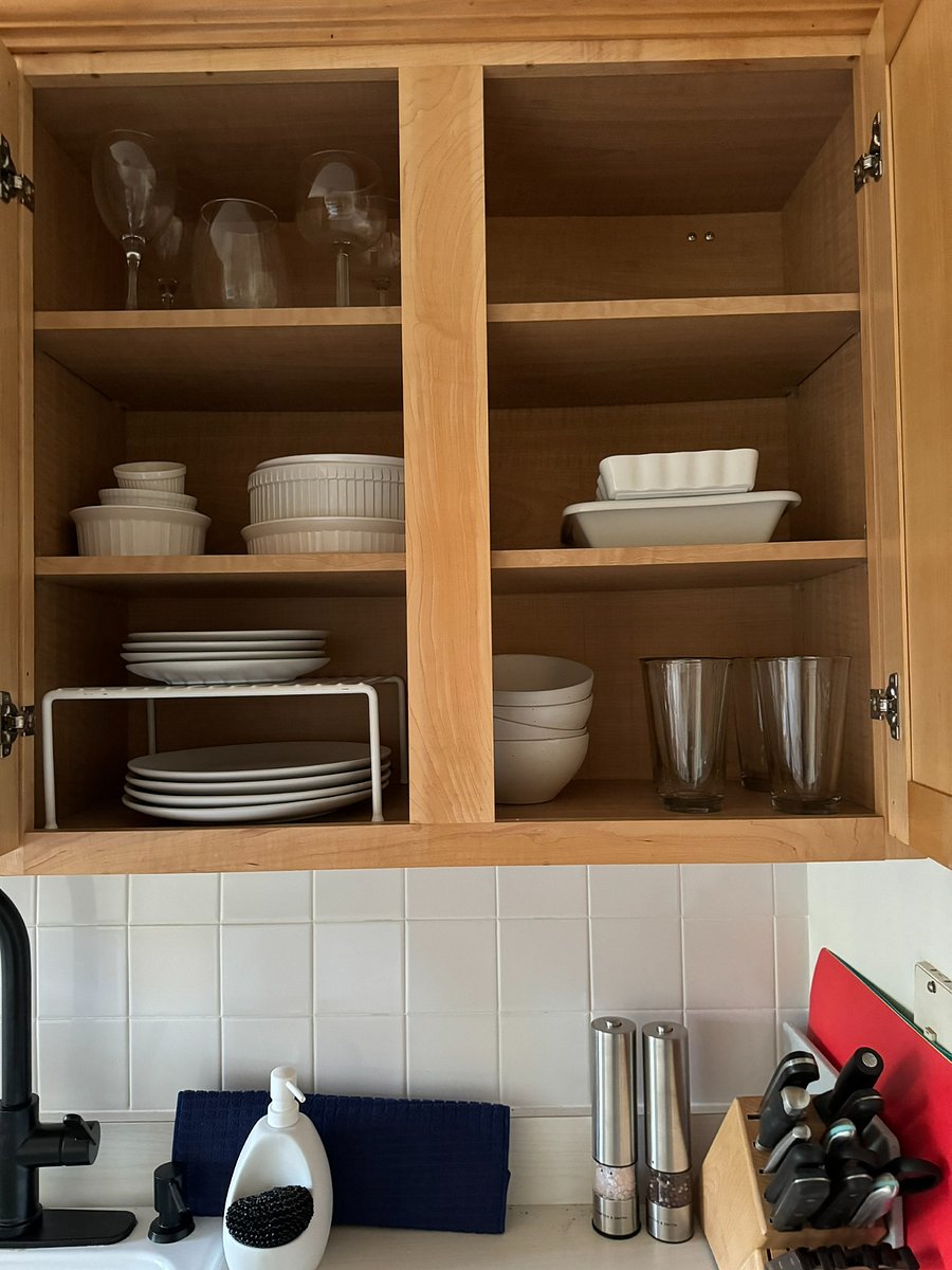 Place settings for 4 as well as baking dishes are in these cupboards.