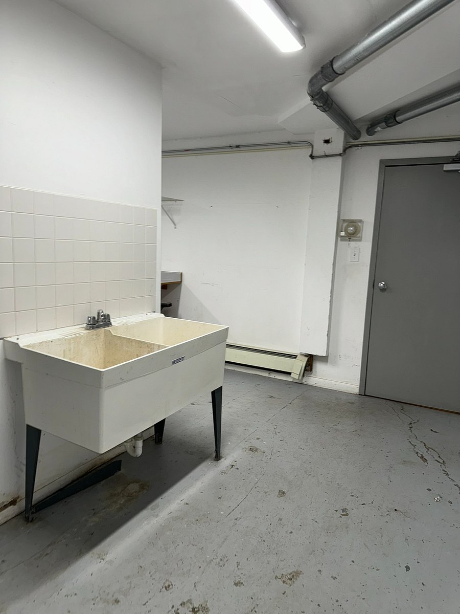 The main-floor laundry room features a deep double-basin sink.  When you've got something big and messy to clean off you'll be glad it's there!