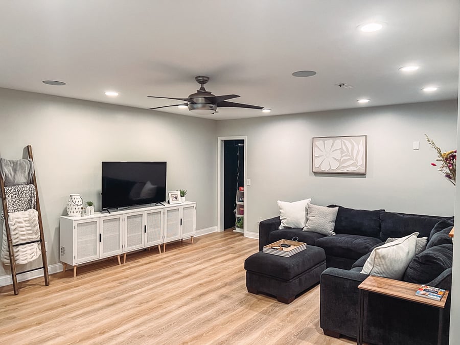 Cozy living room, with spacious sectional and smart TV.