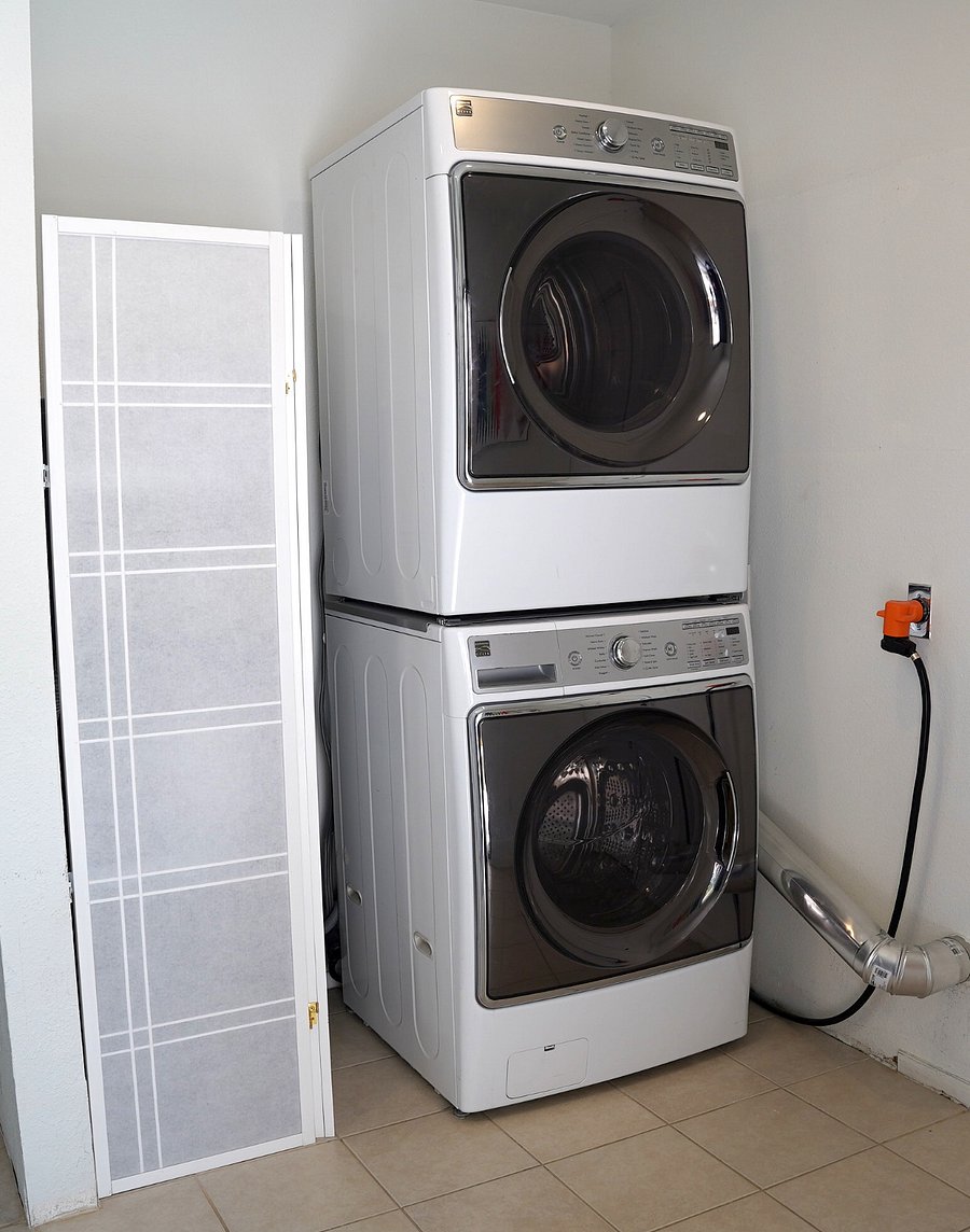 Full-size washer and dryer in unit.