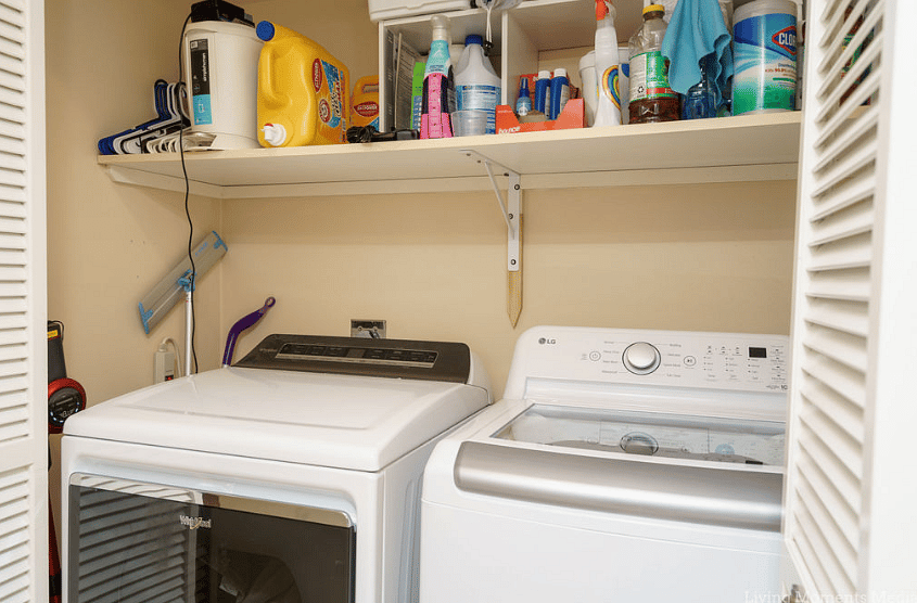 Full size washer and dryer inside the condo in the hallway before entering the main bedroom.