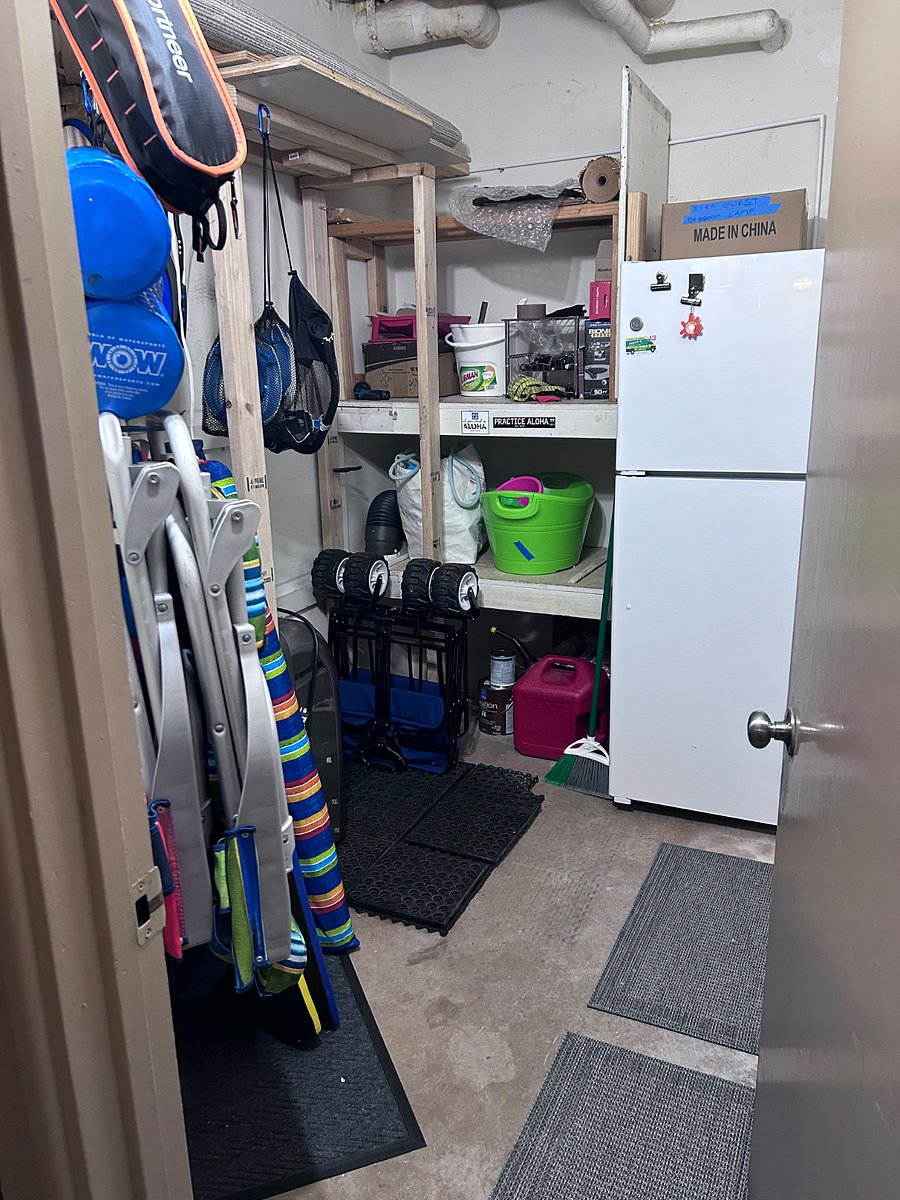This is the extra fridge which is located just outside the front door.  This closet also contains beach chairs and two umbrellas along with some boogie boards and pool noodles.