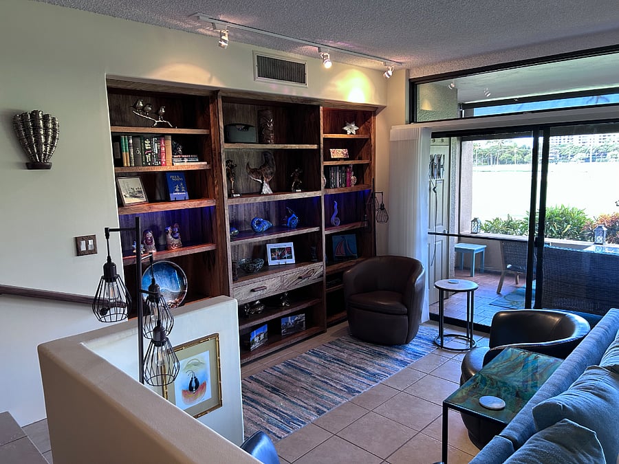  The library shelves and matching media center were all built specifically for our condo,  West Maui Woodworks sourced the wood from fallen trees at the Baldwin Estate and gave it new life here in our home.  The trees used were approximately 100 years old and numbered, making these additions to our home quite special