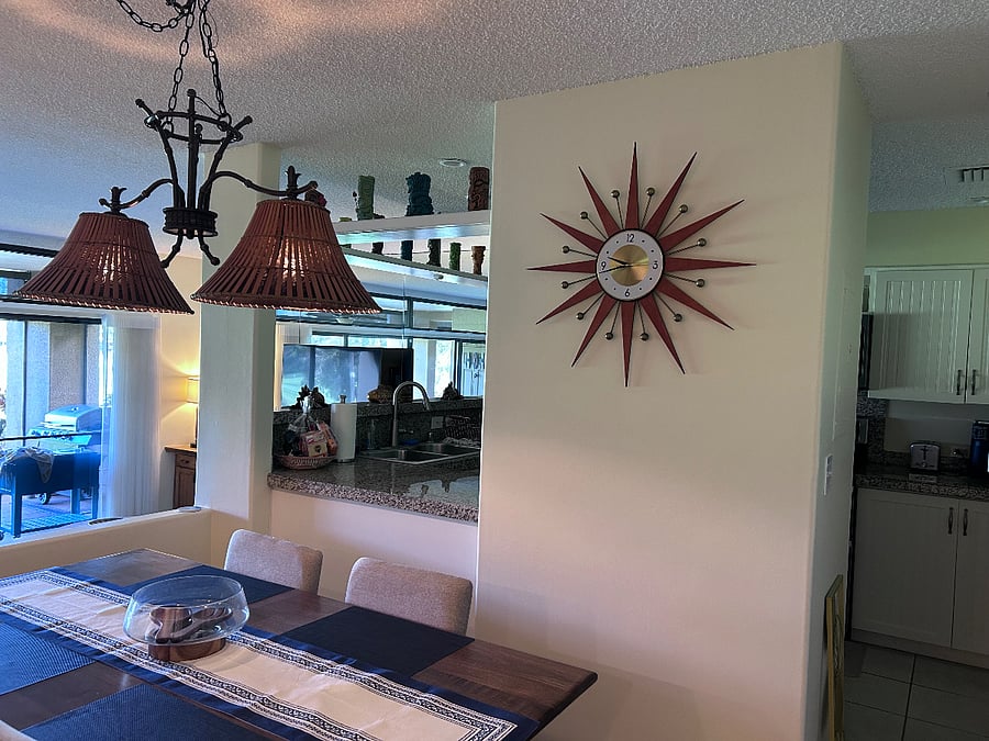 The refrigerator is on the other side of this wall with the clock on it.  As you pass the clock and walk into the kitchen there is a huge pantry on the right side that takes up an entire wall.  There is plenty of room for all your food plus extra items you have so that the condo stays very organized during your vacation.  