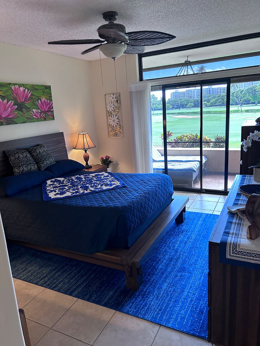 This is the main bedroom with its own set of doors to the lanai.  There is a large closet with a dressing room area attached as well as the en suite bathroom.  There is a small bench not visible in this photo next to the bed and the two full size dressers make it easy to fully move in if you bring a lot of clothing for a longer stay.