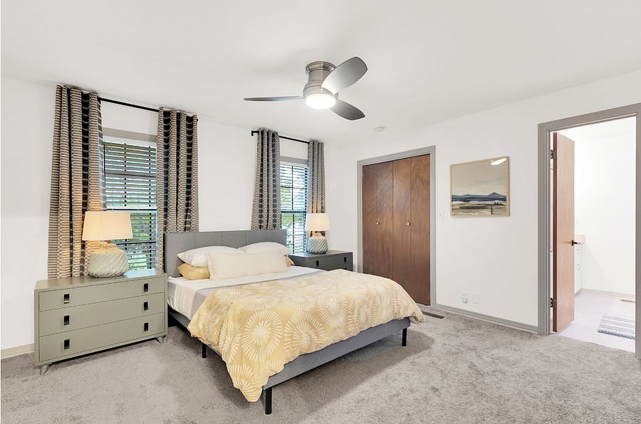 Primary Bedroom (A) with en-suite bathroom. Queen bed, walk in closet, large countertop, and tub&shower combo.