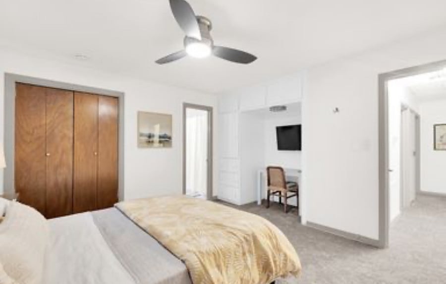 Primary Bedroom (A) with en-suite bathroom. Work station and smart TV