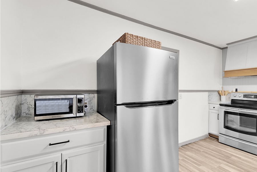 Fully stocked kitchen with microwave and full size fridge. Full size stove and oven.