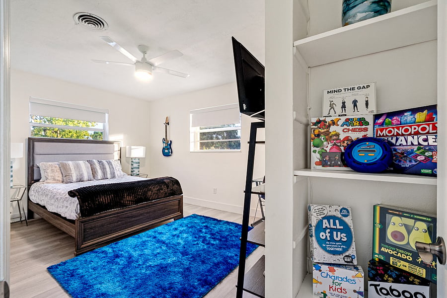 Queen Bedroom #1 with workspace plus a walk in closet. Optional twin bed can be added to this room. This is where all the toys, games, & baby items are stored.