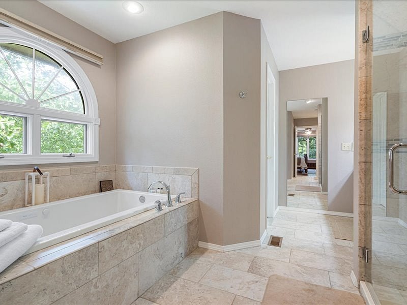 main floor primary tab and walk in shower