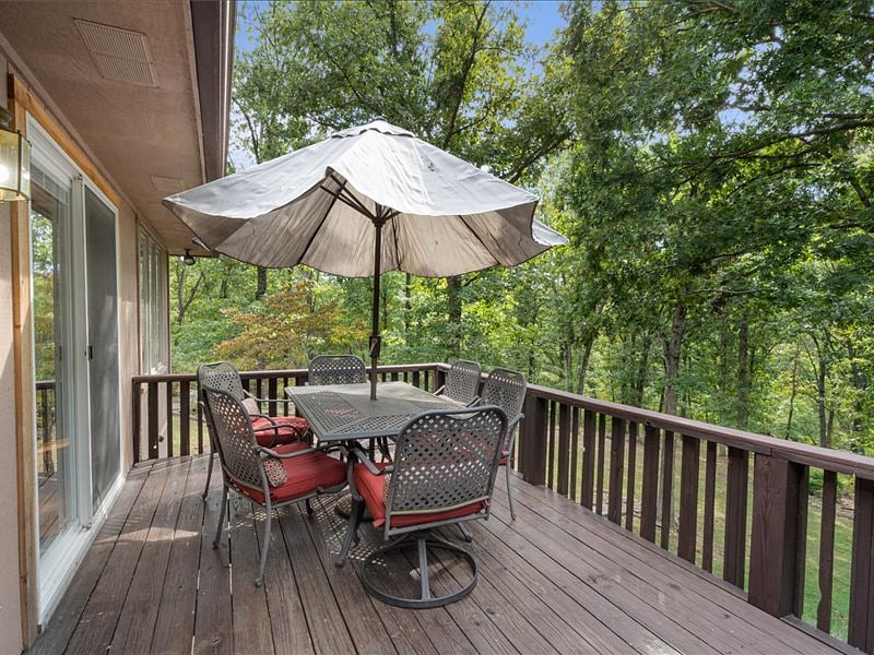 main level patio overlooking 1 acre wooded lot