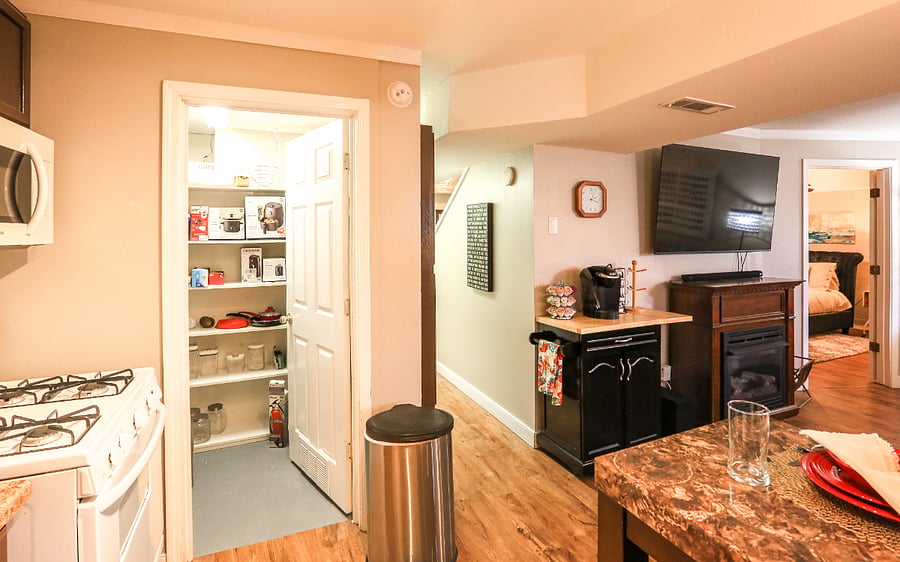 Pantry complete with appliances and storage space.