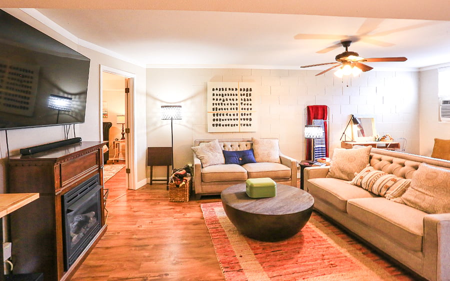 Living area complete with 65 inch smart TV and gas fireplace.