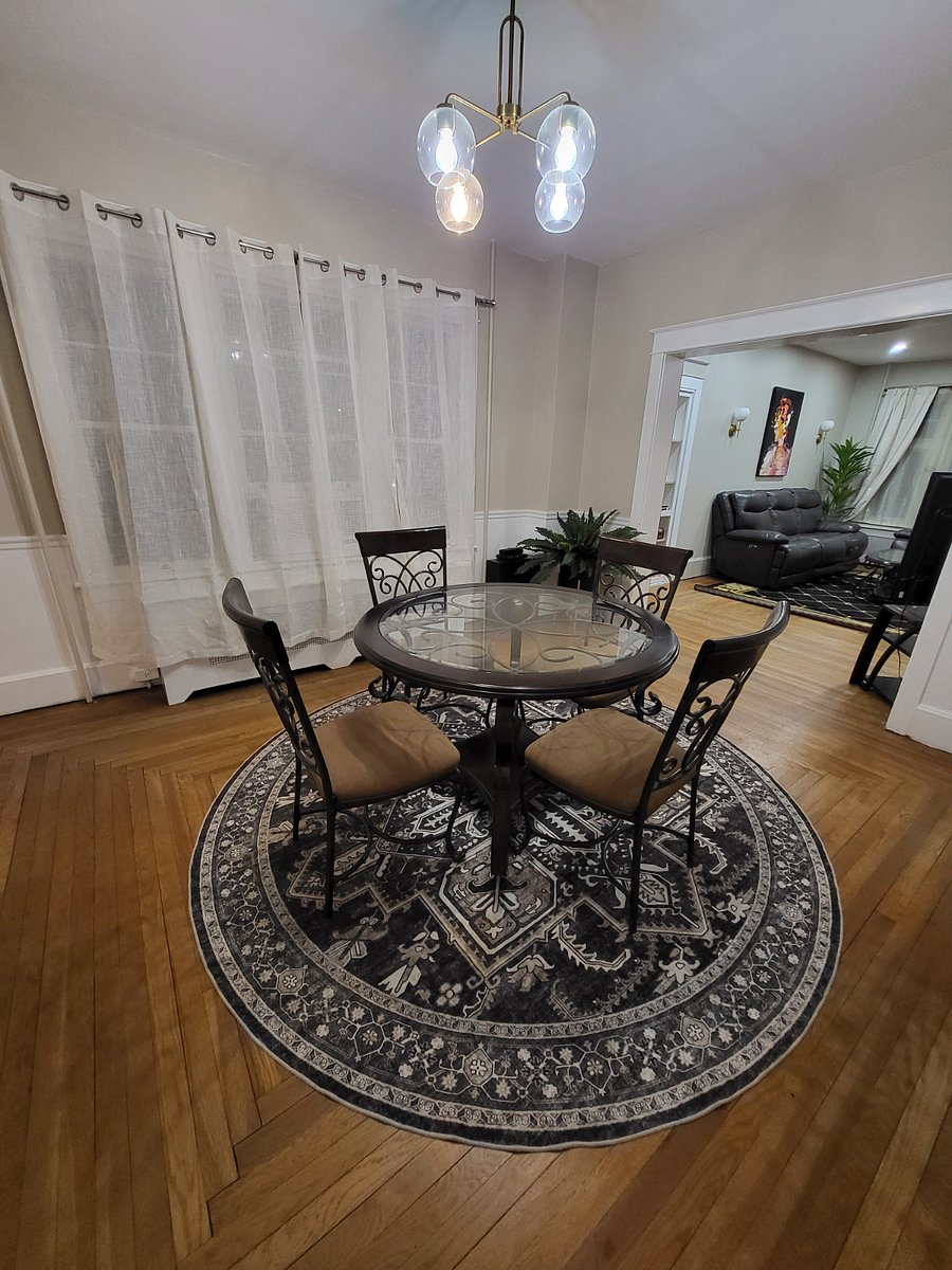 Open concept dining room with table extension to seat up to 8