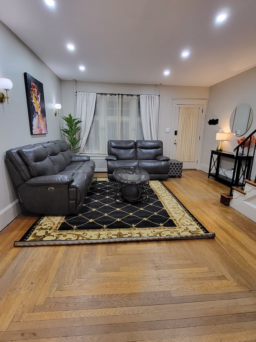 Living room with 65" smart TV (not shown).