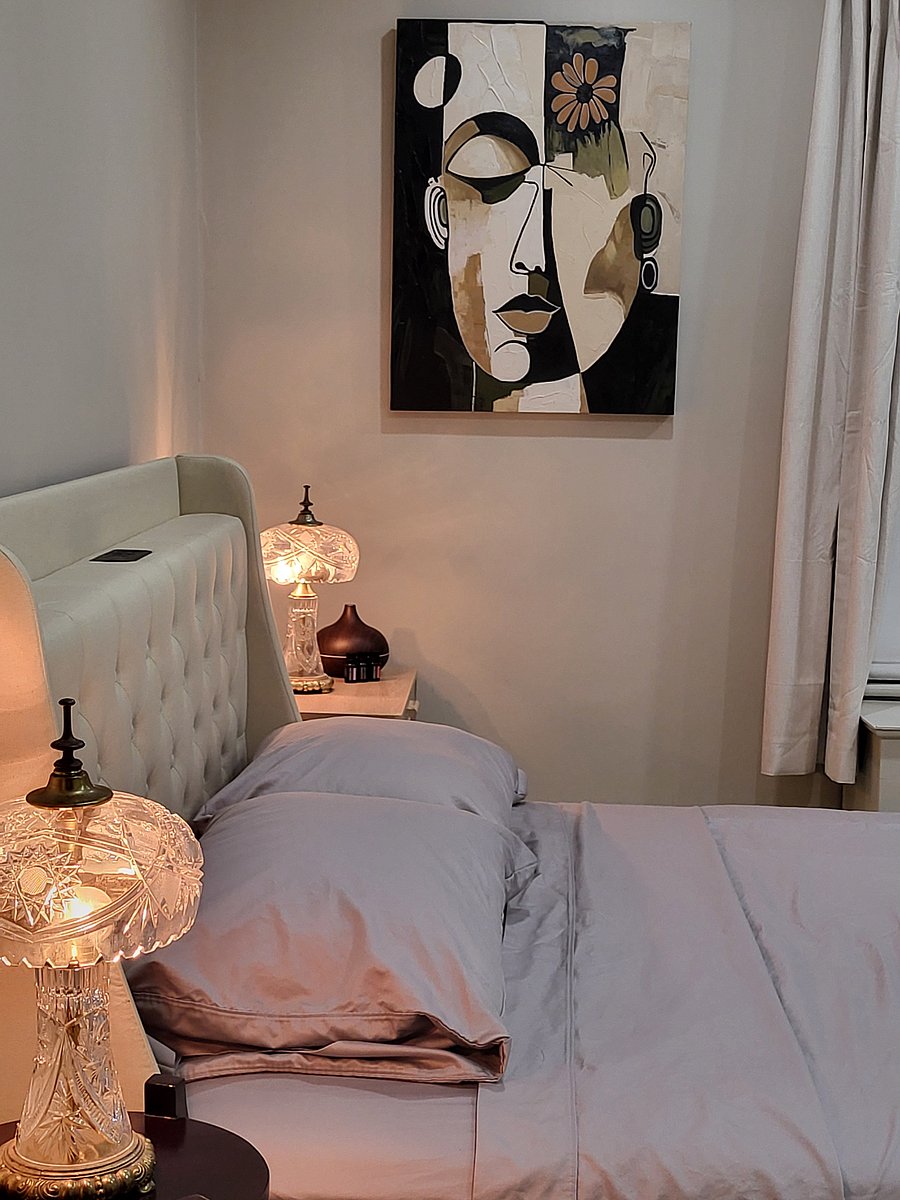 Queen sized bed with USB and three prong plugs in bed and side table. Air conditioner during summer months.