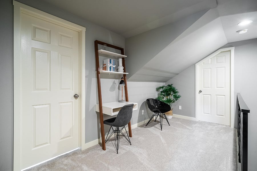 Top of the stairs between the 2 bedrooms and shared bathroom.
