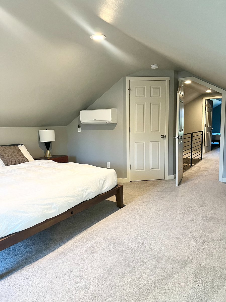 Large upstairs bedroom with walk in closet and king bed.