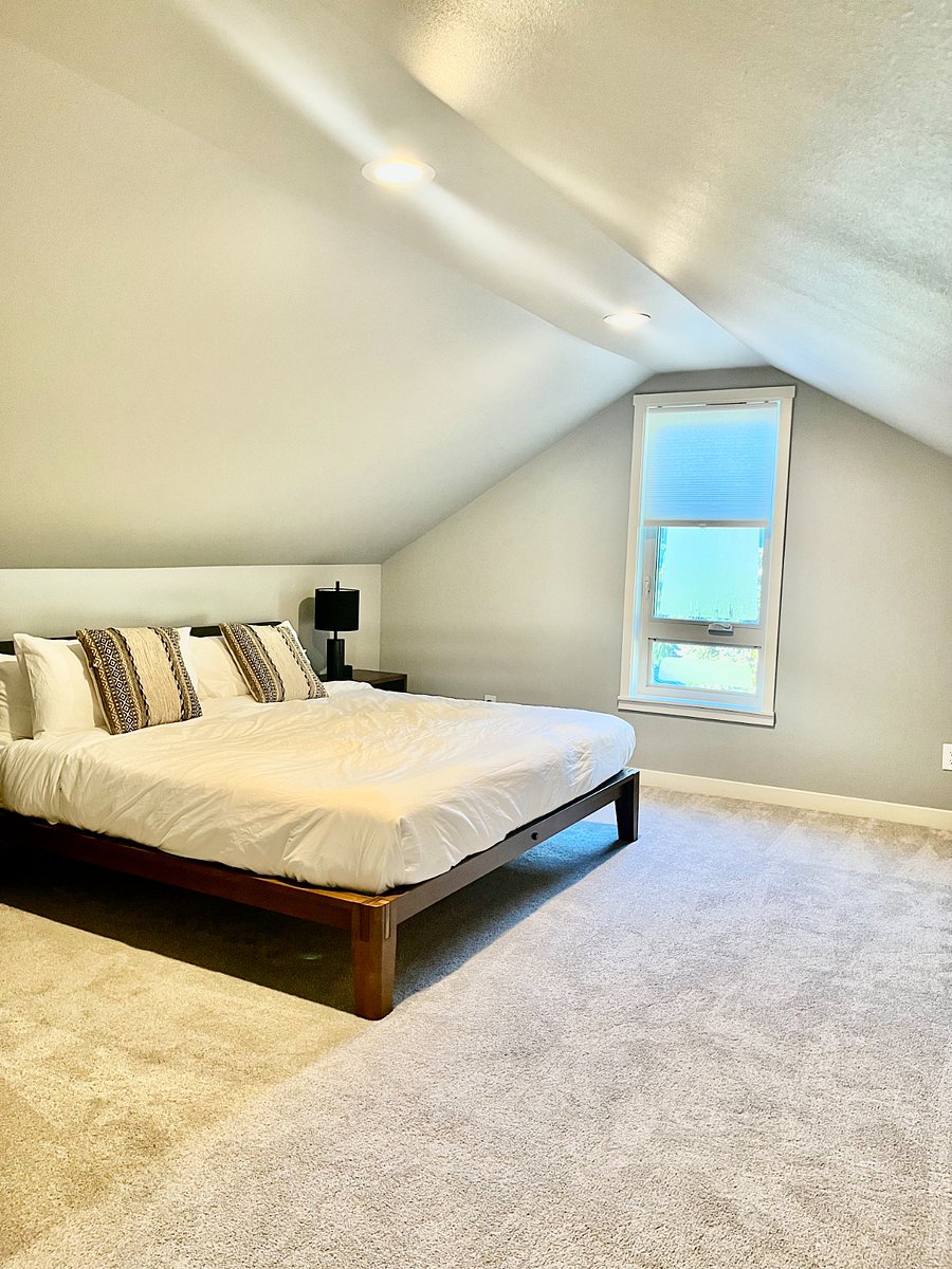 Another large upstairs bedroom with king bed.
