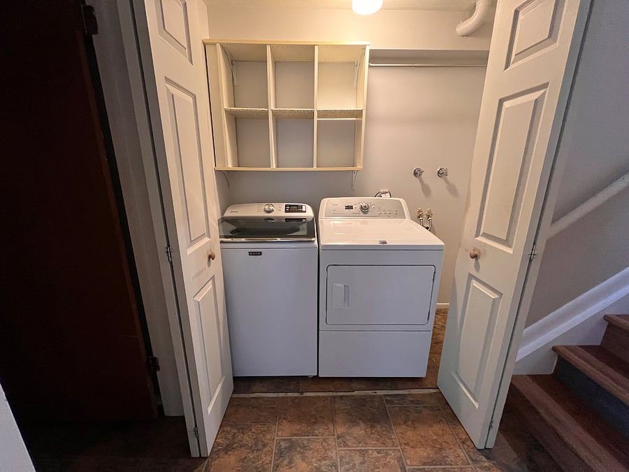 Full-size washer and dryer conveniently located on the garden level for easy access during extended stays.