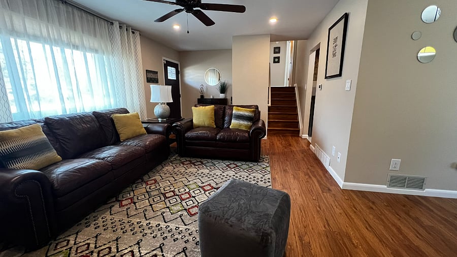 Alternate view of the main living area showing the front entry and open flow throughout the home.
