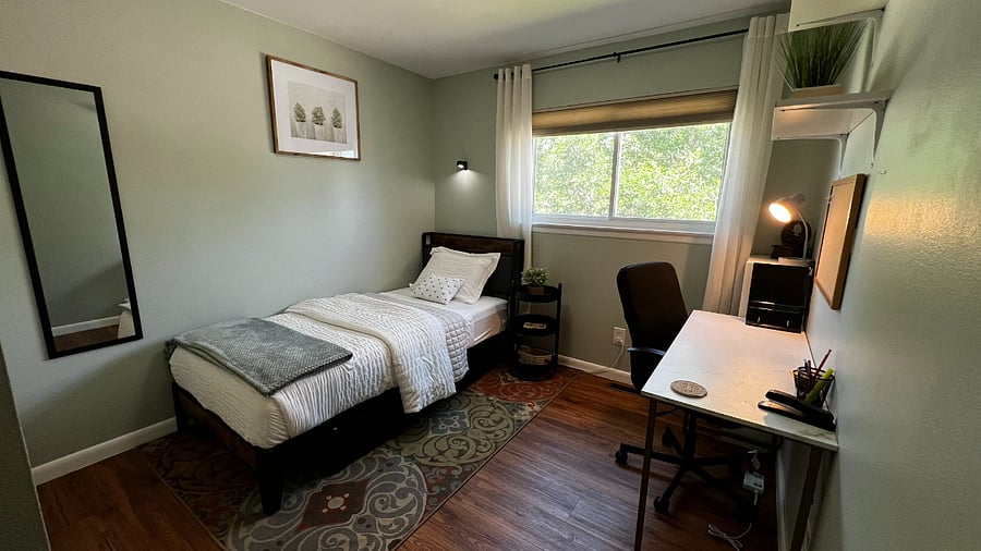 Quiet bedroom with a Twin XL bed and dedicated workspace, ideal for remote work or study.
