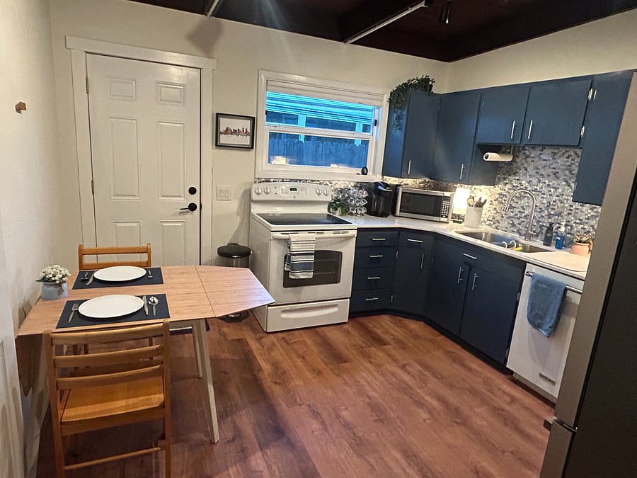Table has fold outs to seat four people. Kitchen is fully stocked with dishes, pots and pans, storage containers and utensils and applicances including a keurig, toaster oven, blender, crock pot and instapot.