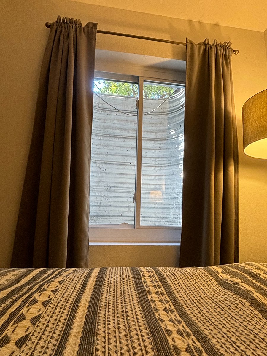Egress window with black out curtains
