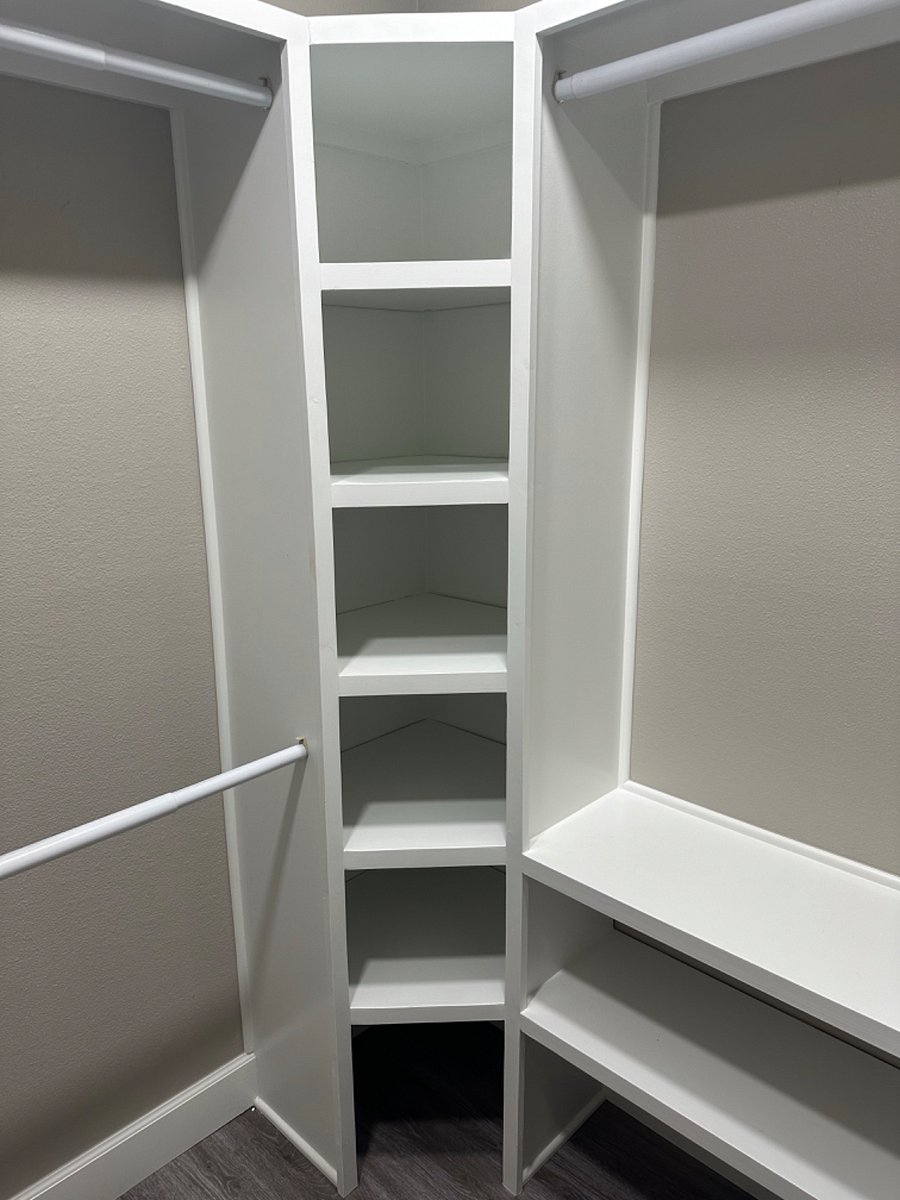 Walk in master closet with shelving