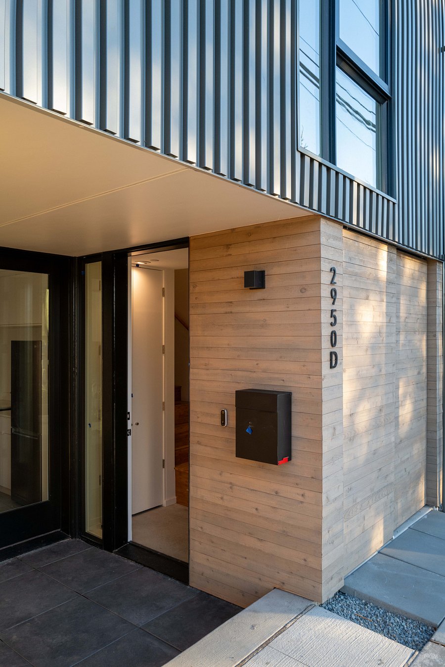 Covered entry patio provides direct access to studio unit, with a place to sit at the end of the day looking at the Lake Union sunset.