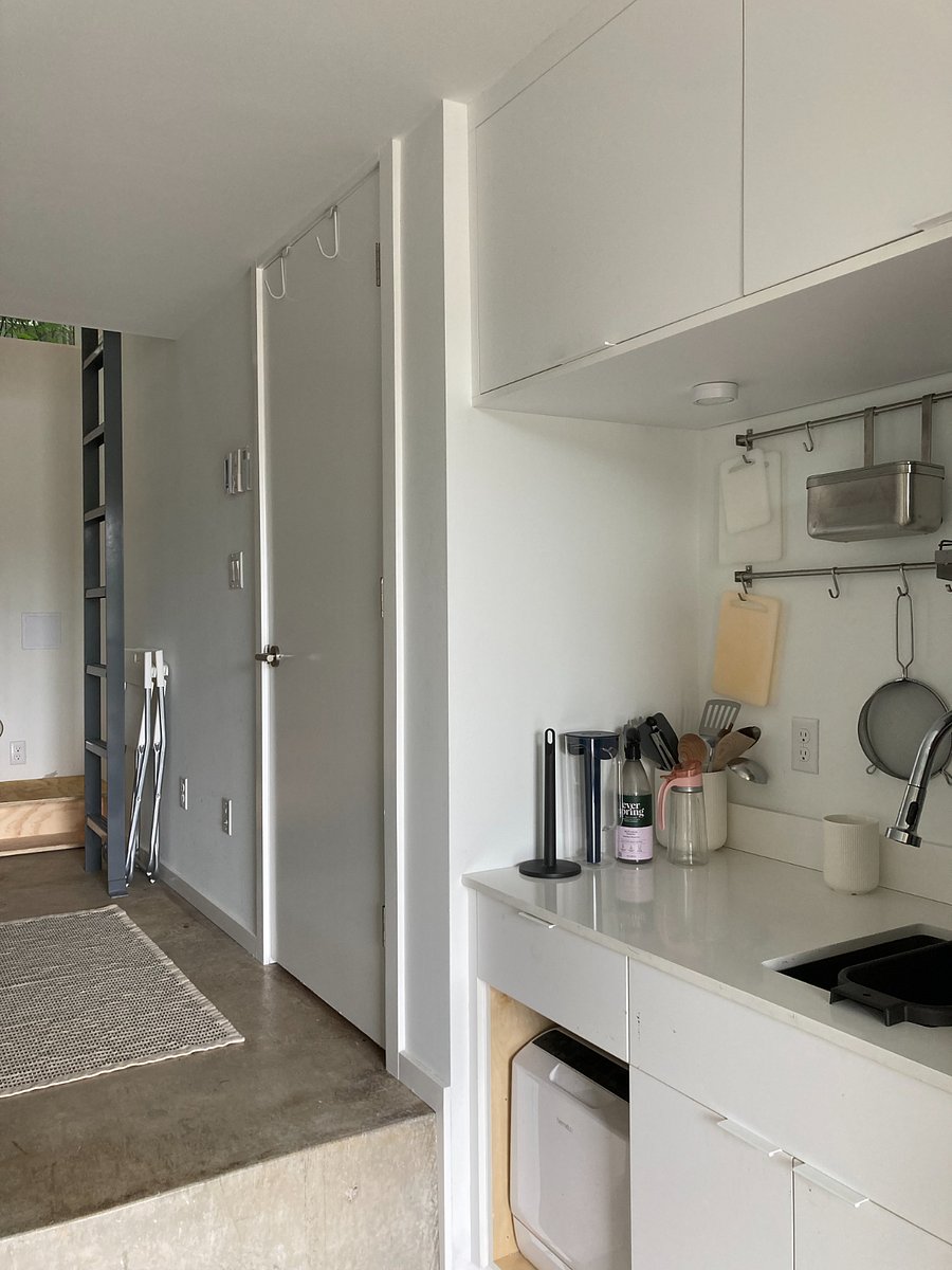 View of Kitchenette and door to bathroom.