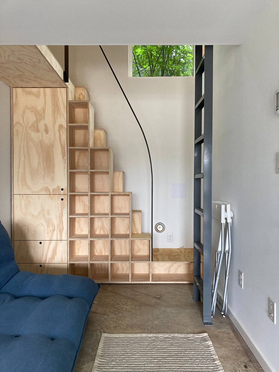View looking towards double height space with 'Tansu' stair/cabinet.