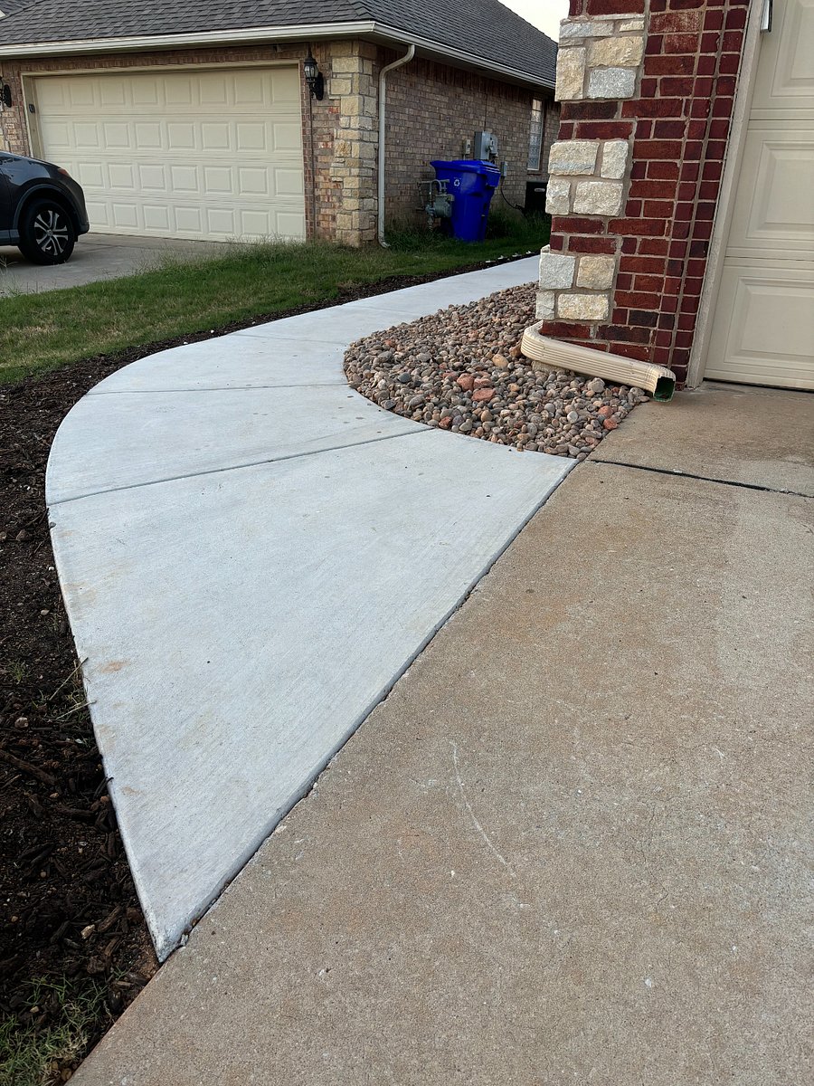 Driveway parking with concrete path to your own private entrance.