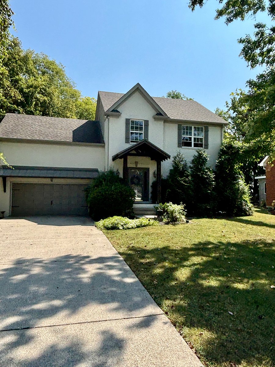 Exterior view of home with (1) rental suite available. The suite is above the garage. Concrete driveway for 4-6 cars for ample parking.