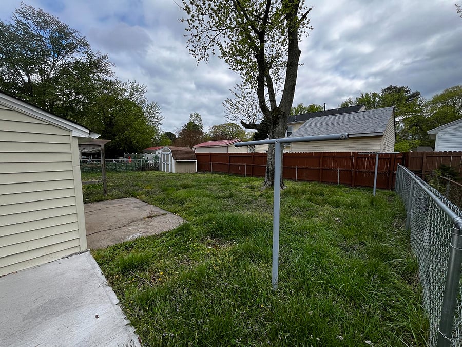 Backyard is fenced in for medium to large sized dogs. There is one slot where fence connects to home where a small dog can slip through.