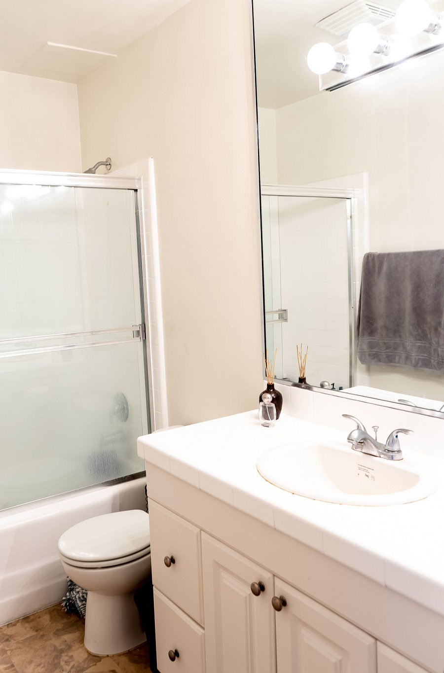 Bathroom 2 with tub / shower combo and large vanity.  This bathroom is located in the hallway next to Bedroom 2.  