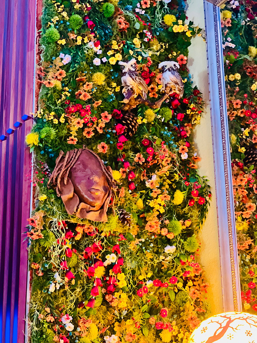Faux living wall depicting African art