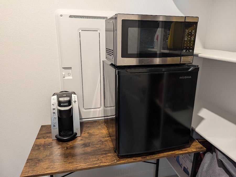 In addition to main kitchen, this kitchenette is for guests personal use. Easily accessible next to guest's room in the laundry room. Storage/shelves next to microwave/minifridge available for guest storage.