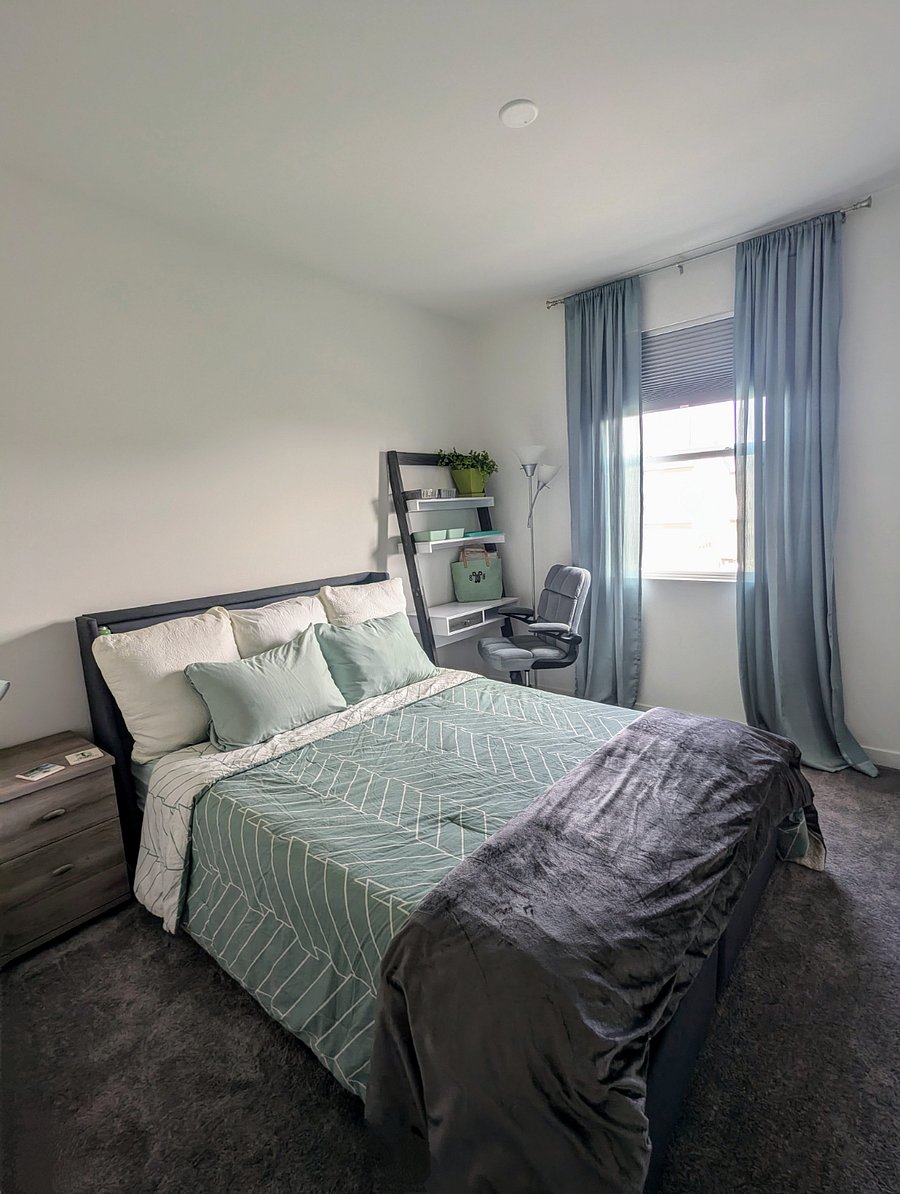 Room #1
Peaceful and quiet private room includes queen size bed, nightstand, desk lamp, work station, lamp, shelves, dresser, light blocking shades w/ decorative curtains, and mounted 43" smart tv with remote.