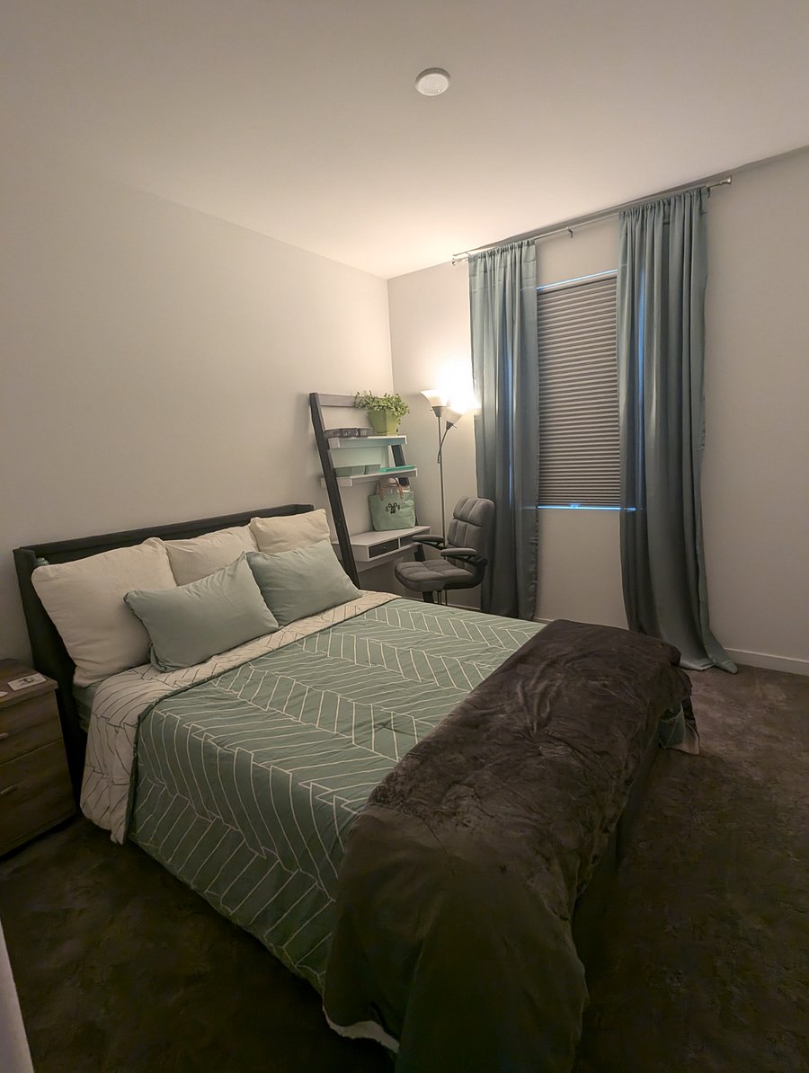 Room #1
Peaceful and quiet private room includes queen size bed, nightstand, desk lamp, work station, lamp, shelves, dresser, light blocking shades w/decorative curtains, and mounted 43" smart tv with remote.